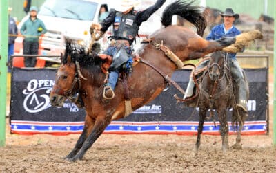 Riding in the Rain – Athletes and Broncs Grace Sentinel Butte at the “Home on the Range Match of Champions”